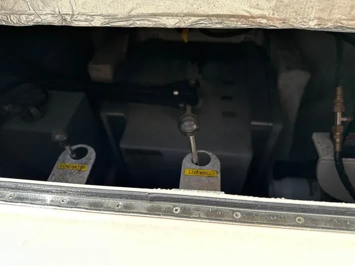 Katy Lady Yacht Photos Pics 2017 Grady-White Canyon 376 boat compartment with generator and livewell controls.