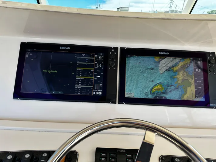 Katy Lady Yacht Photos Pics Simrad navigation screens on 2017 Grady-White Canyon 376 boat dashboard.