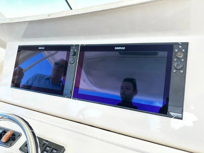 Katy Lady Yacht Photos Pics Simrad navigation screens on 2017 Grady-White Canyon 376 boat dashboard.