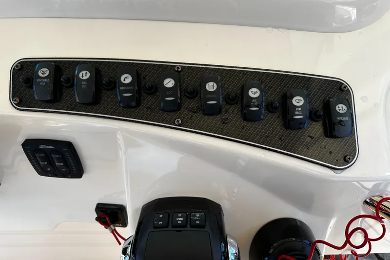 Katy Lady Yacht Photos Pics Control panel of a 2017 Grady-White Canyon 376 boat with various switches.