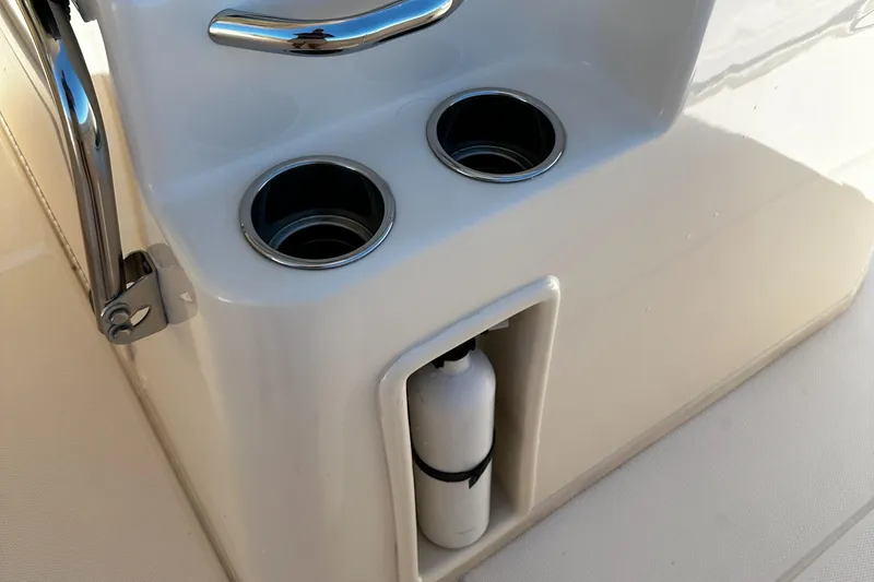 Katy Lady Yacht Photos Pics 2017 Grady-White Canyon 376 boat console with cup holders and storage compartment.