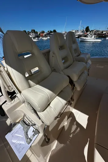 Katy Lady Yacht Photos Pics 2017 Grady-White Canyon 376 boat interior with luxurious seating, docked at a marina.