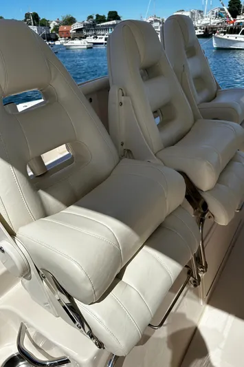 Katy Lady Yacht Photos Pics Luxurious seating on 2017 Grady-White Canyon 376 boat, with scenic harbor view.