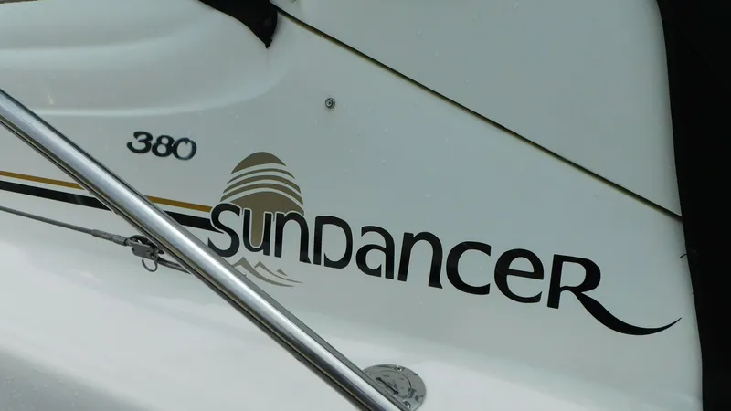 Yacht Photos Pics 2002 Sea Ray 380 Sundancer boat logo on white surface.
