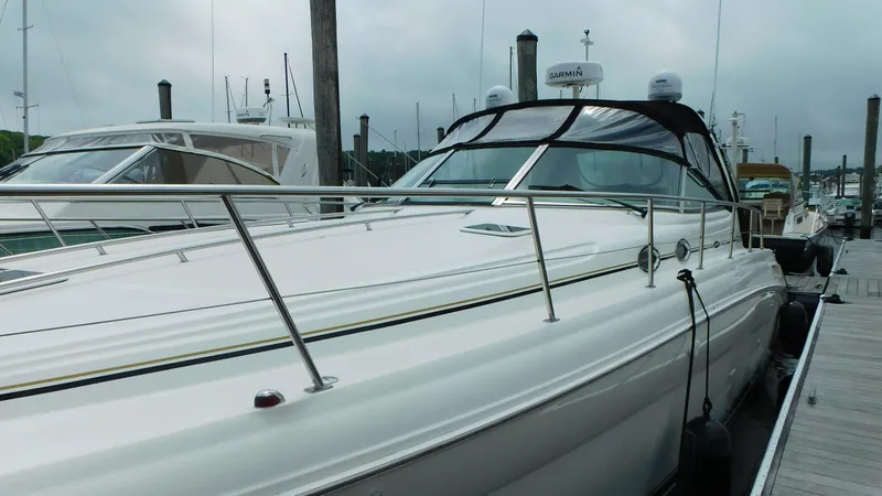  Yacht Photos Pics 2002 Sea Ray 380 Sundancer docked at marina, showcasing sleek design and spacious deck.