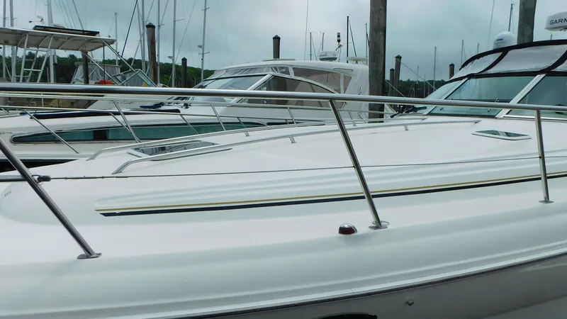  Yacht Photos Pics 2002 Sea Ray 380 Sundancer yacht docked at marina, featuring sleek design and polished railings.