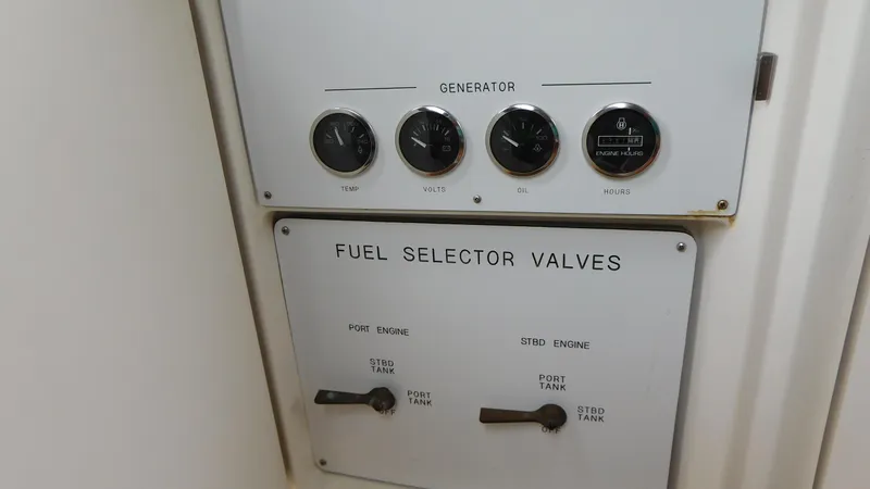  Yacht Photos Pics Control panel of a 2002 Sea Ray 380 Sundancer with fuel selector valves and generator gauges.