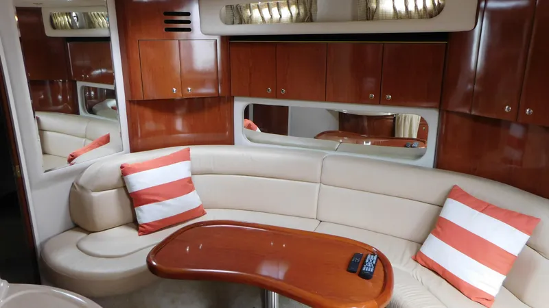  Yacht Photos Pics Luxurious interior of 2002 Sea Ray 380 Sundancer with plush seating and wooden accents.