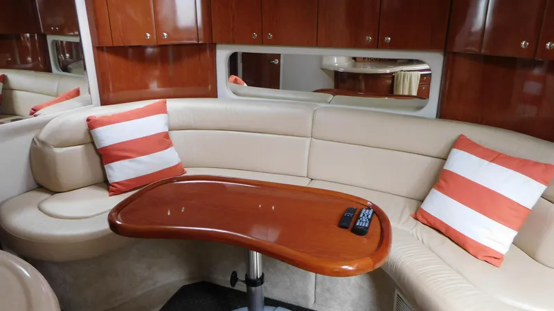  Yacht Photos Pics Luxurious 2002 Sea Ray 380 Sundancer interior with plush seating and striped cushions.