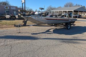 1988 Bass Tracker Pro 17 boat on trailer in outdoor dealership lot.