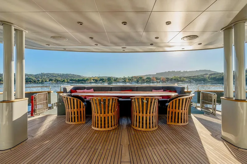  Yacht Photos Pics Luxurious outdoor seating on 2007 Baglietto 43 yacht, overlooking serene waters and scenic landscape.