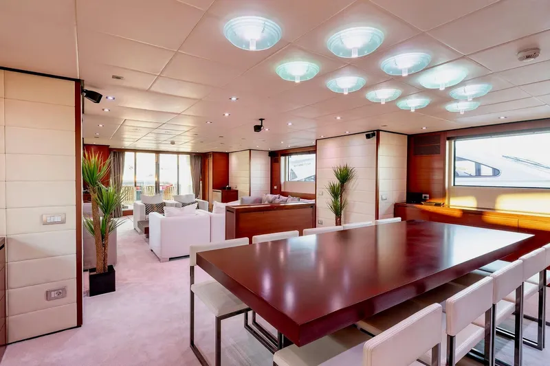  Yacht Photos Pics Luxurious interior of 2007 Baglietto 43 yacht with modern dining and seating areas.