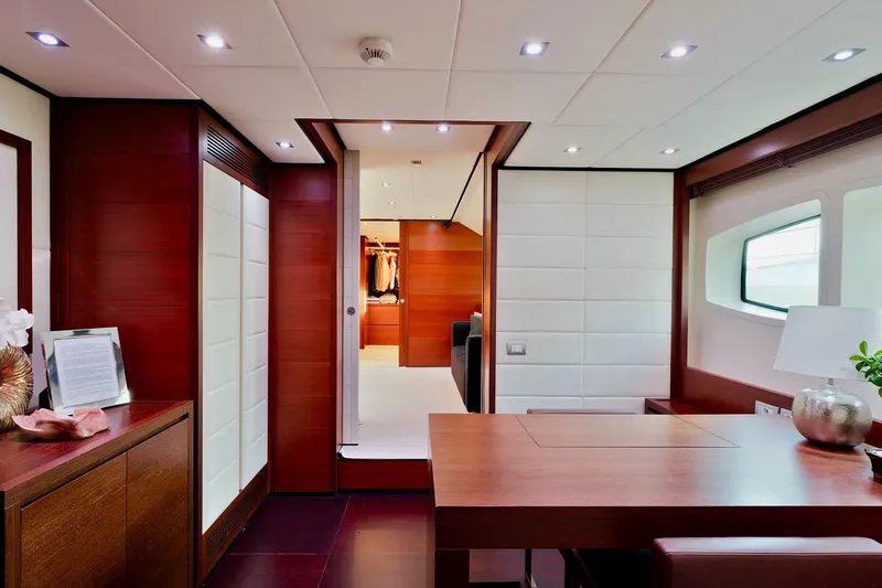  Yacht Photos Pics Luxurious interior of 2007 Baglietto 43 yacht with elegant wood and white paneling.