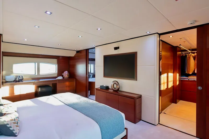  Yacht Photos Pics Luxurious bedroom interior on 2007 Baglietto 43 yacht, featuring modern design and elegant furnishings.
