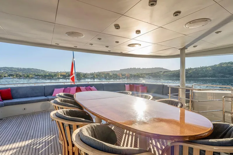  Yacht Photos Pics Luxurious 2007 Baglietto 43 yacht deck with elegant seating and scenic water views.