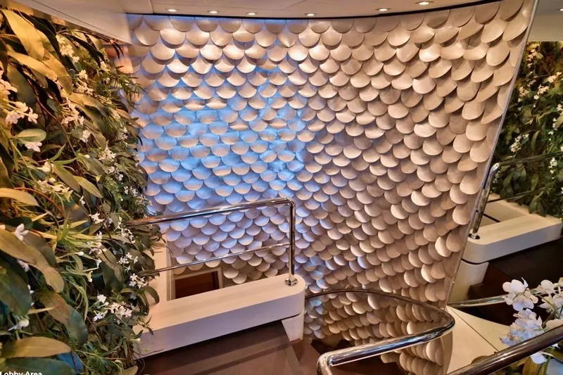  Yacht Photos Pics Luxurious yacht interior with elegant staircase, floral decor, and textured wall design on Baglietto 43, 2007.