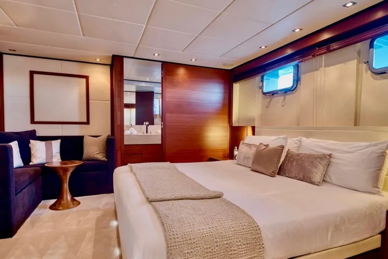 Yacht Photos Pics Luxurious bedroom interior of 2007 Baglietto 43 yacht with elegant decor and cozy seating.