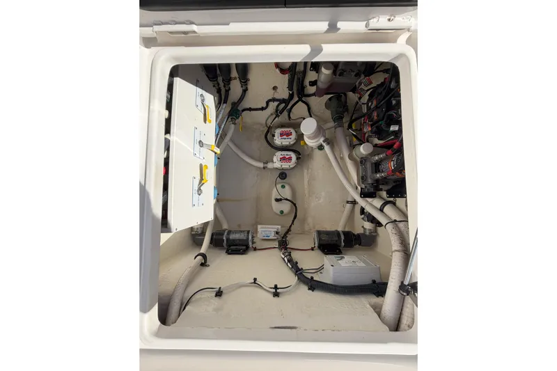 Huddle Up Yacht Photos Pics 2018 Jupiter 38 FS boat compartment with wiring and plumbing systems.