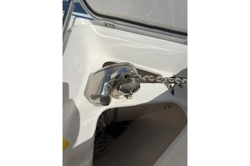 Huddle Up Yacht Photos Pics Anchor chain mechanism on a 2018 Jupiter 38 FS boat deck.
