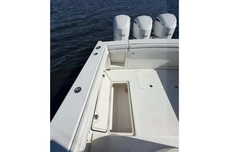 Huddle Up Yacht Photos Pics 2018 Jupiter 38 FS boat deck with storage and triple engines on water.