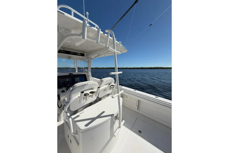 Huddle Up Yacht Photos Pics 2018 Jupiter 38 FS boat interior with ocean view and clear blue sky.