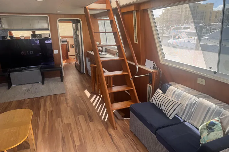 Cleodora Yacht Photos Pics Interior of 1988 Viking 63 Cockpit Motor Yacht with cozy seating and wooden accents.