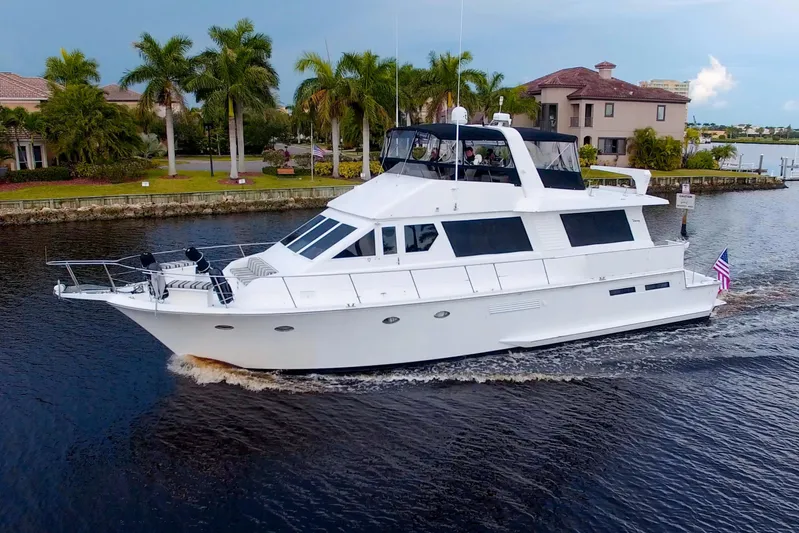 Cleodora Yacht Photos Pics 1988 Viking 63 Cockpit Motor Yacht cruising on a scenic waterway.
