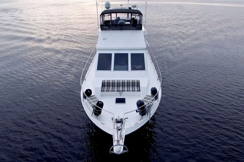 Cleodora Yacht Photos Pics 1988 Viking 63 Cockpit Motor Yacht on calm water, aerial view.