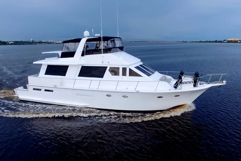 Cleodora Yacht Photos Pics 1988 Viking 63 Cockpit Motor Yacht cruising on calm waters.