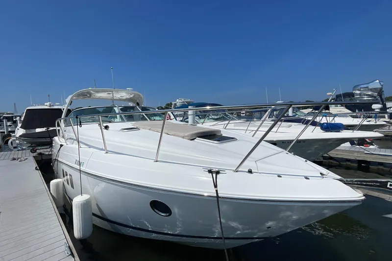  Yacht Photos Pics 2017 Rinker EX 370 boat docked at marina under clear blue sky.
