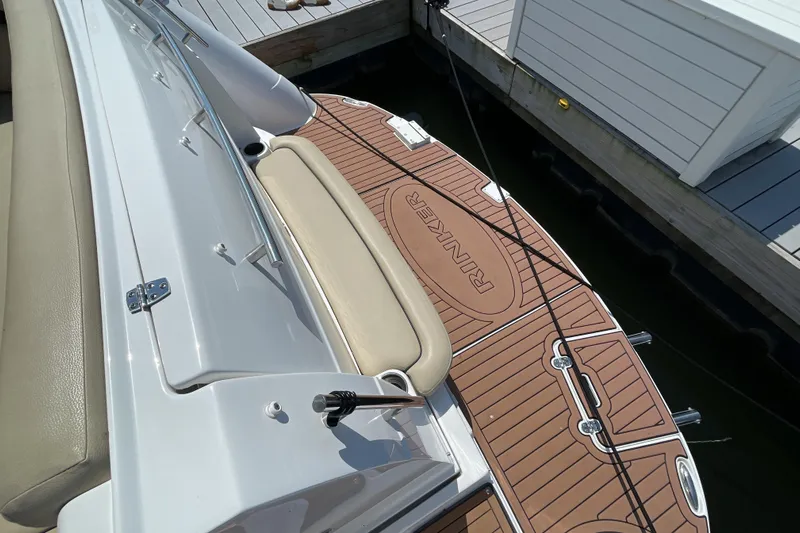  Yacht Photos Pics 2017 Rinker EX 370 boat docked, featuring a teak-style swim platform.