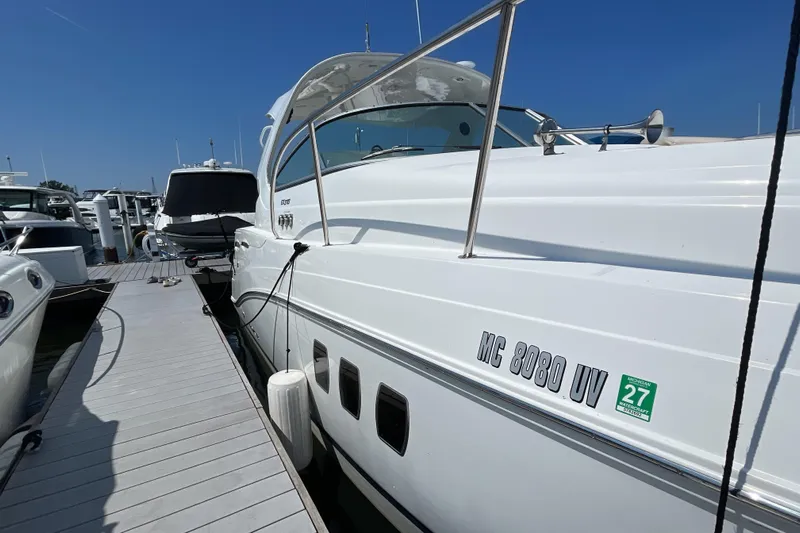  Yacht Photos Pics 2017 Rinker EX 370 yacht docked at marina under clear blue sky.