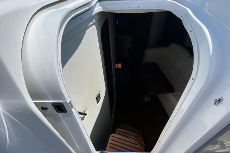  Yacht Photos Pics 2017 Rinker EX 370 cabin entrance with white interior and wooden table.