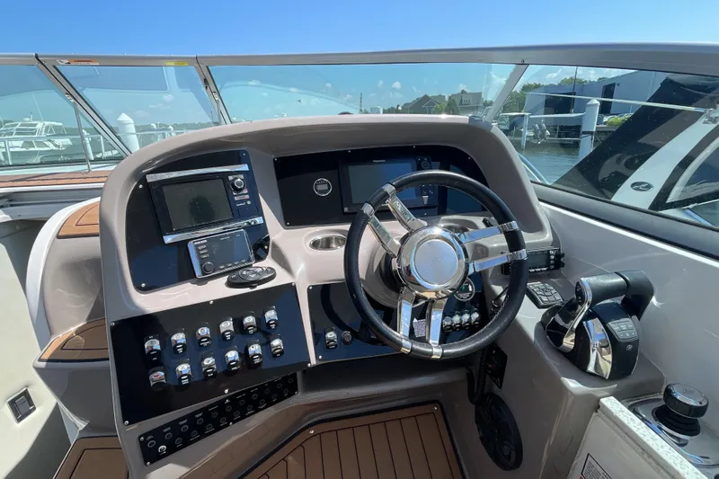  Yacht Photos Pics 2017 Rinker EX 370 helm with modern controls and navigation systems.