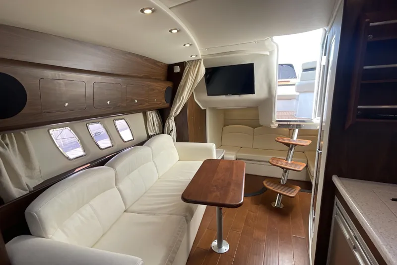  Yacht Photos Pics Luxurious interior of 2017 Rinker EX 370 yacht with elegant seating and modern amenities.