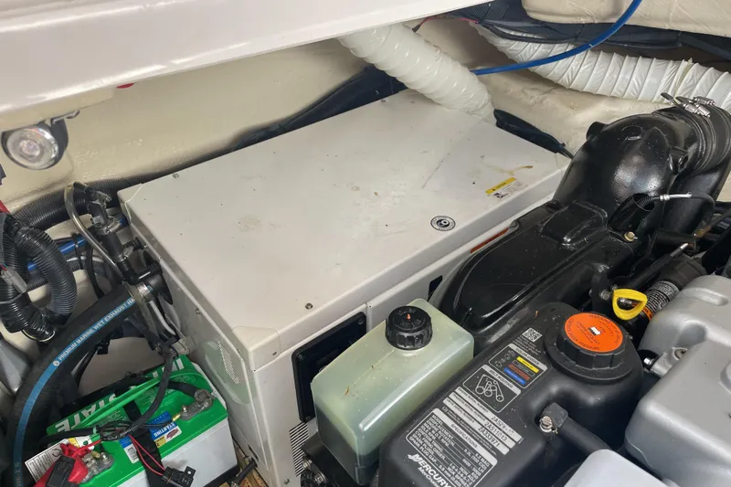  Yacht Photos Pics Engine compartment of a 2017 Rinker EX 370 boat, featuring various mechanical components.