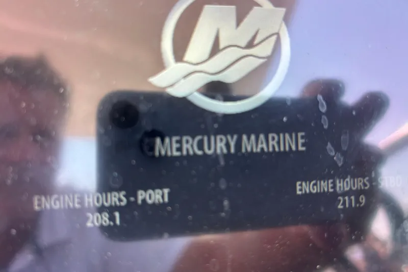  Yacht Photos Pics Reflection on Mercury Marine display showing engine hours for Rinker EX 370, 2017 model.