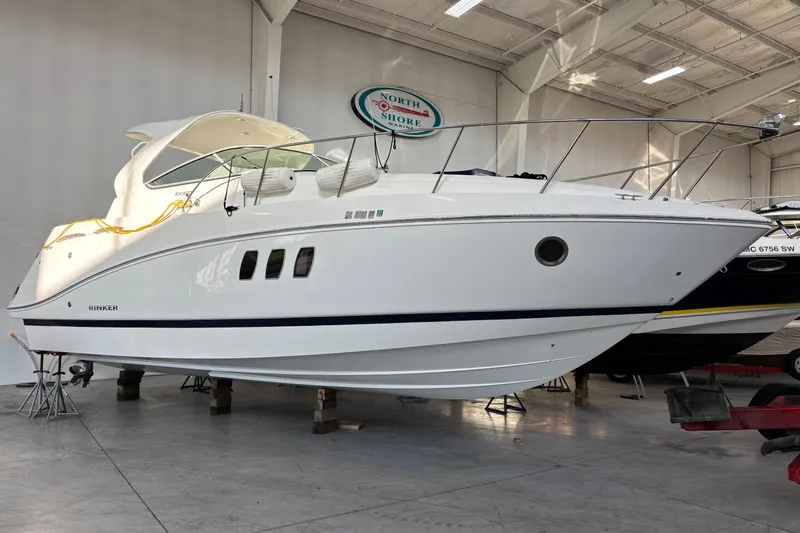  Yacht Photos Pics 2017 Rinker EX 370 boat displayed indoors on stands.