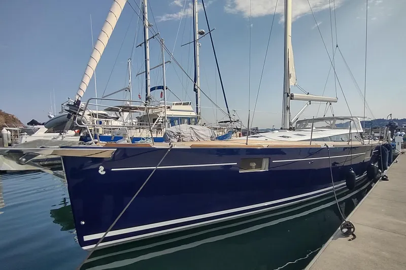 Indigo Sea Yacht Photos Pics 2018 Beneteau Sense 57 yacht docked at marina, featuring sleek blue hull design.