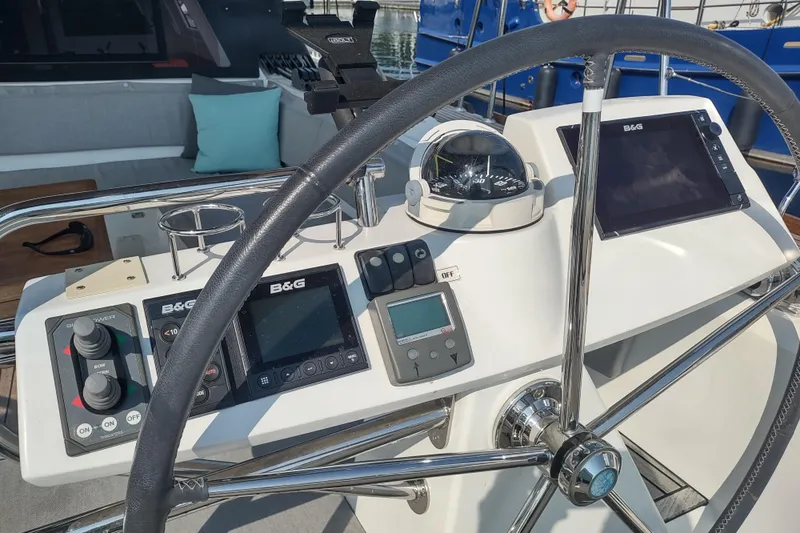 Indigo Sea Yacht Photos Pics Cockpit of 2018 Beneteau Sense 57 yacht with navigation instruments and steering wheel.