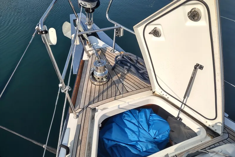 Indigo Sea Yacht Photos Pics 2018 Beneteau Sense 57 yacht deck with open storage compartment and winch.