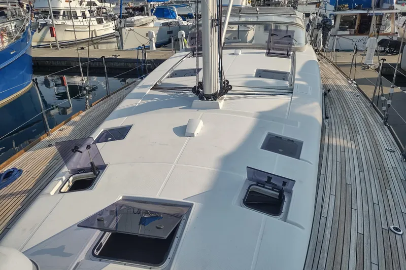 Indigo Sea Yacht Photos Pics 2018 Beneteau Sense 57 yacht deck with open hatches at marina.