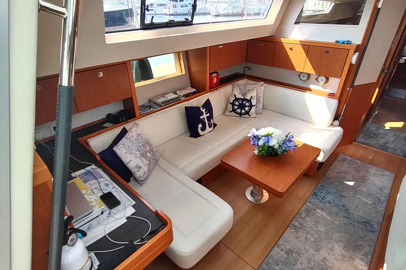 Indigo Sea Yacht Photos Pics Luxurious interior of 2018 Beneteau Sense 57 yacht with elegant seating and decor.