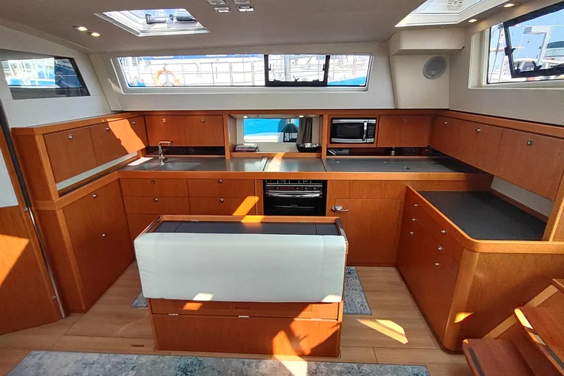 Indigo Sea Yacht Photos Pics Interior of 2018 Beneteau Sense 57 yacht featuring modern kitchen design.