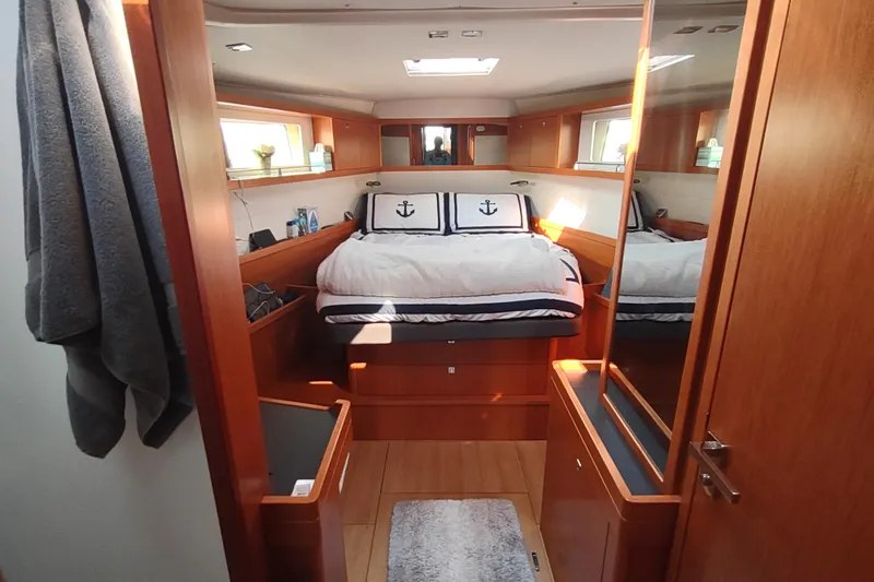 Indigo Sea Yacht Photos Pics Luxurious cabin interior of 2018 Beneteau Sense 57 yacht with nautical decor.