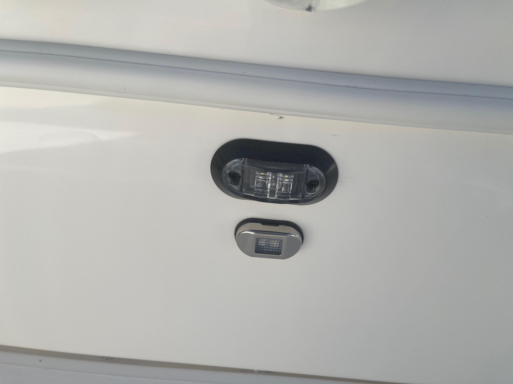 2025 Skeeter SX221 boat detail showing navigation lights on white hull.