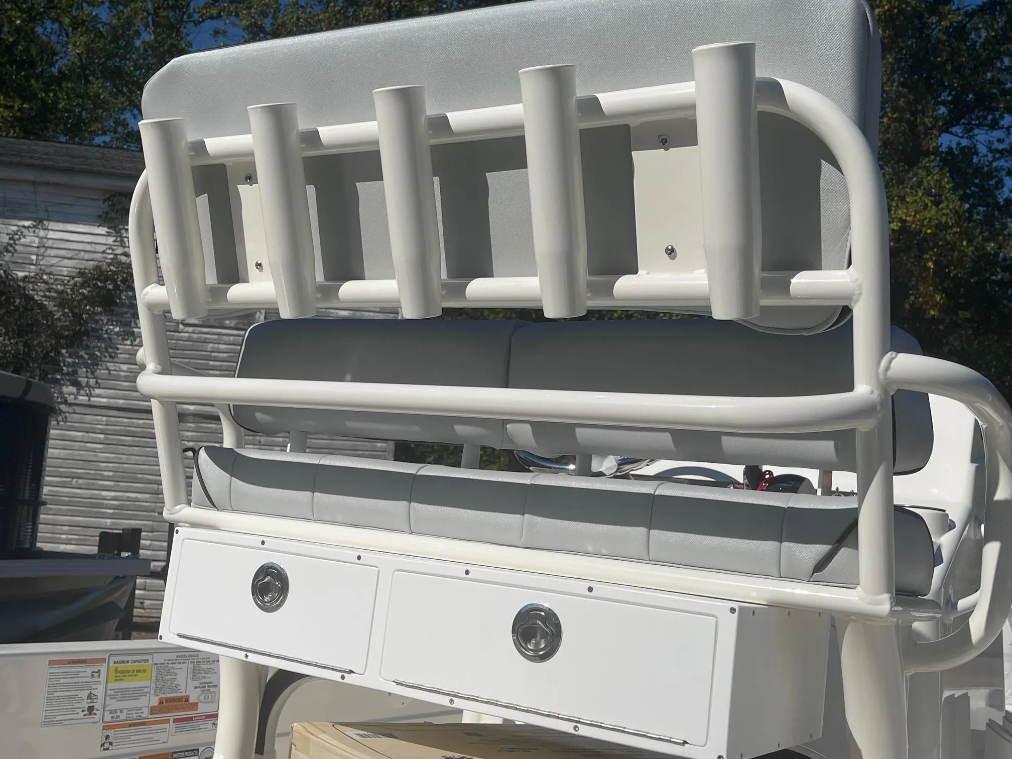 2025 Skeeter SX221 boat seat with rod holders and storage drawers.