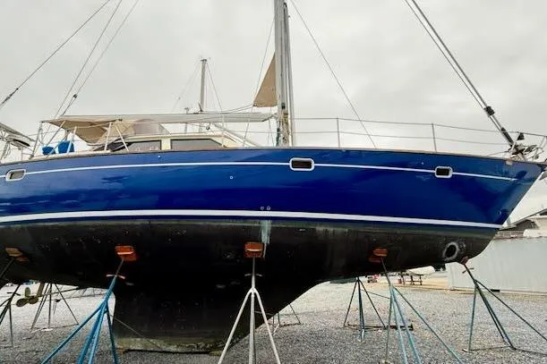 Mavi Yacht Photos Pics 1991 Oyster 49 sailboat on stands, blue hull, ready for maintenance.