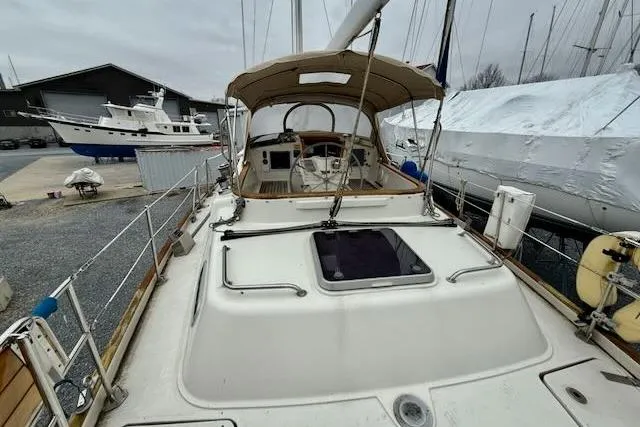 Mavi Yacht Photos Pics Sailing yacht Oyster 49, 1991 model, docked at marina with overcast sky.