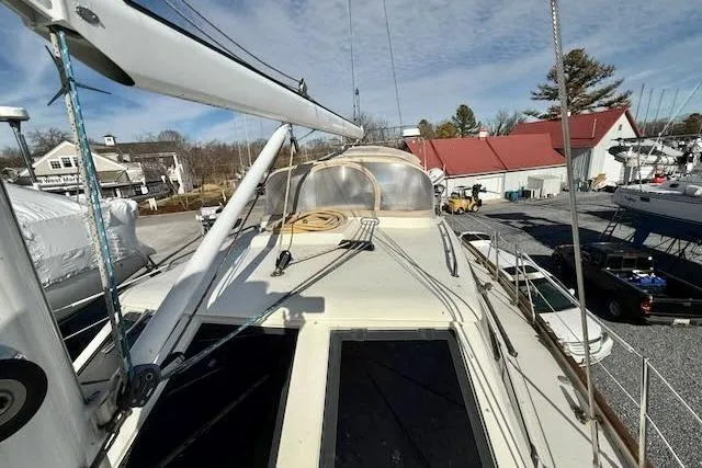Mavi Yacht Photos Pics Sailboat deck view of 1991 Oyster 49, docked with clear sky background.